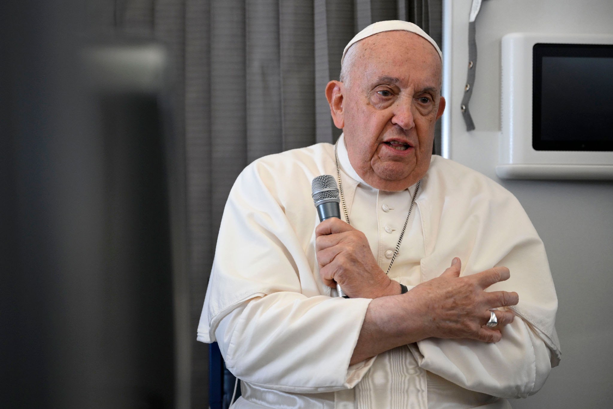 SINGAPORE - SINGAPORE - SEPTEMBER 13: (EDITOR NOTE: STRICTLY EDITORIAL USE ONLY - NO MERCHANDISING). Pope Francis speaks with journalists aboard the return flight from Singapore on September 13, 2024 aboard the flight from Singapore to Rome. On the flight back to Rome from Singapore, Pope Francis spoke to the journalists accompanying his Apostolic Journey to Asia and Oceania. (Photo by Vatican Media via Vatican Pool/Getty Images)